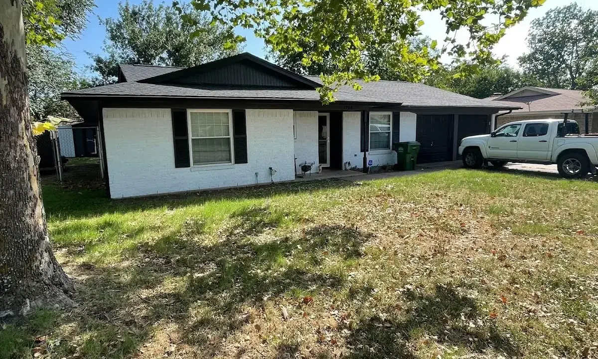 Professional roofing crew working on a residential roof in Ave Maria